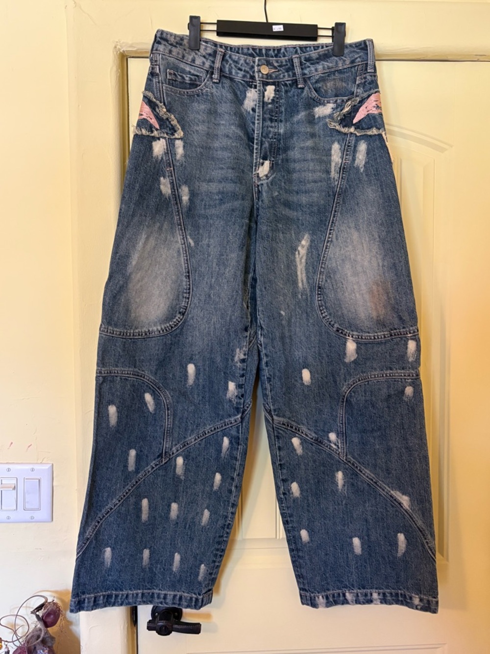 Acne Studios | Distressed baggy jeans. Pink wing design. Made in Italy. Size 33